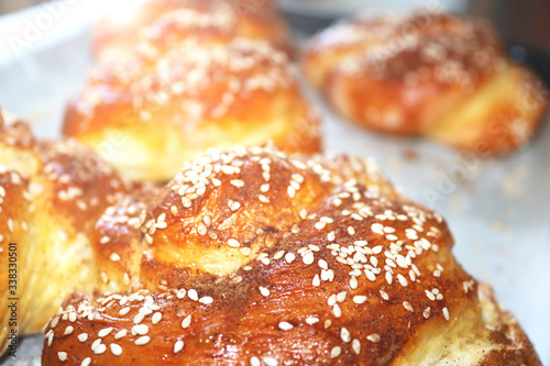 Fresh twisted buns with sesame seeds in the early morning. Morning sunshine