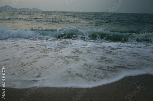 on the edge of the water