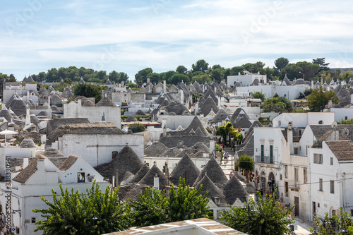  Tradtional white houses in Trulli village. Alberobello, Italy. The style of construction is specific to the Murge area of the Italian region of Apulia Made of limestone and keystone.