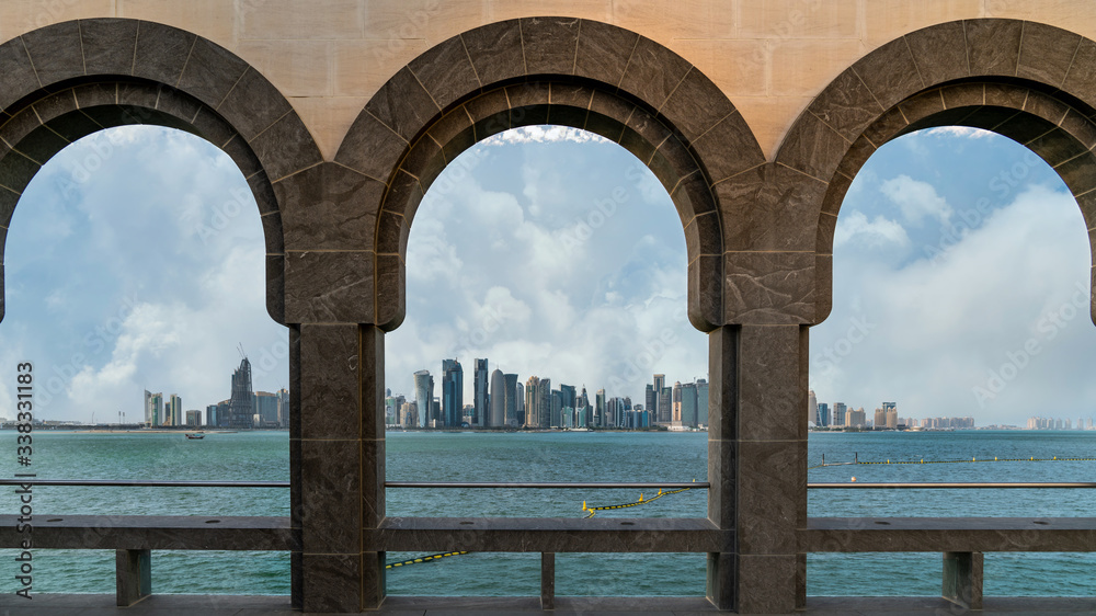 Doha, Qatar - February 2019: Doha skyline through as seen from Museum of Islamic art