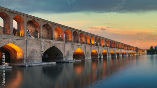 Isfahan, Iran - May 2019: Iranian people on SioSePol or Bridge of 33 arches, one of the oldest bridges of Isfahan photo