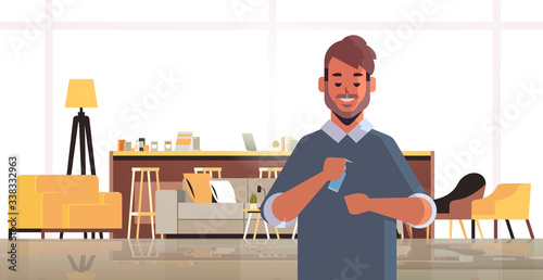 man applying antibacterial spray covid-19 virus bacteria disinfection stop coronavirus pandemic quarantine concept living room interior horizontal portrait vector illustration