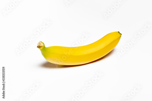 Single Banana isolated on white background. High-resolution photo.