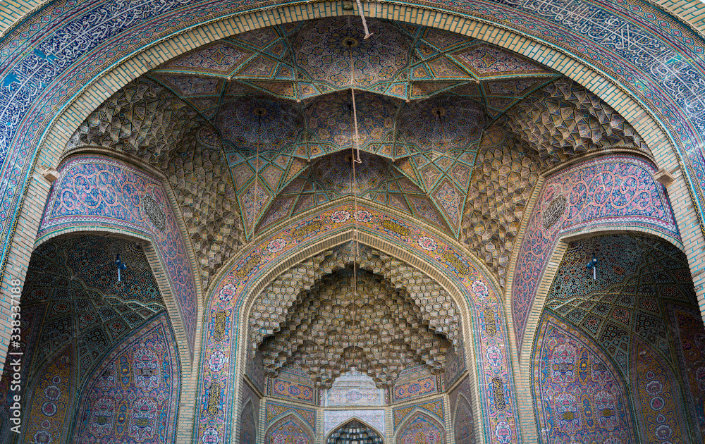 Iran, Shiraz - May 2019: Interior scene with colored tiles and walls of Nasir al-Mulk Mosque