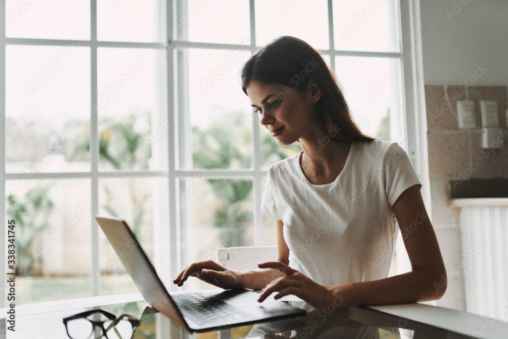 young woman working on laptop