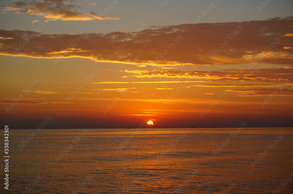 sunrise or sunset on the beach