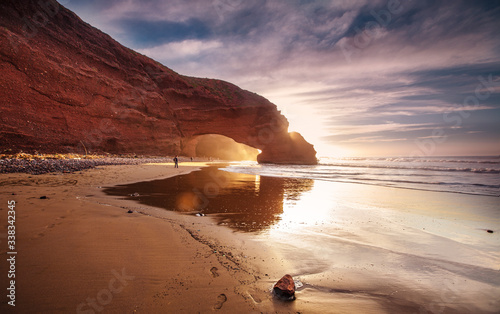 Sunset at red arches of Legzira beach, Sidi Ifni, Souss-Massa-Draa, Morocco