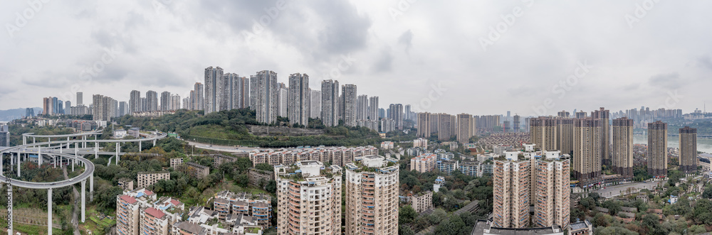 Aerial panoramic drone shot of residential building by flyover in Chongqing, China