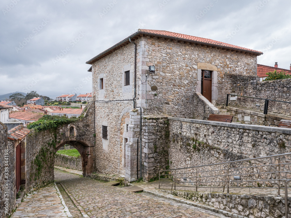 View of Torre del Preboste Tower and La Barrera or Santander City Gate, in San Vicente de la Barquera, Cantabria, Spain