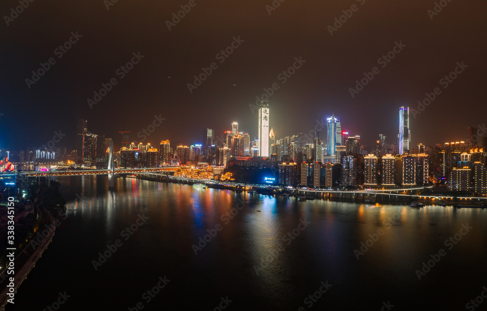 Obraz premium Panoramic aerial night view of Hong Ya Dong cave by Jialing river in Chongqing, southwest China