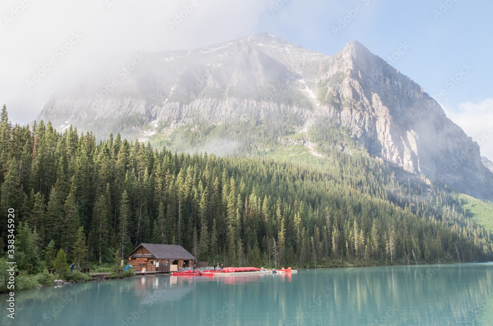 Lake Louise Boat House with red canoes in Canada
