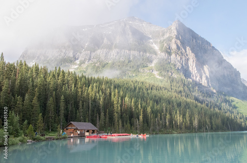 Lake Louise Boat House with red canoes in Canada