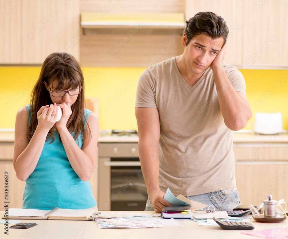 Fototapeta premium Young family struggling with personal finance