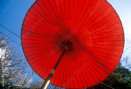 A red Japanese umbrella at the Engaku-Ji Zviroku-San Dai-Engaku Kosho Zen-Jin  a Zen Center  Kamakura  Little Old Kyoto  near Tokyo