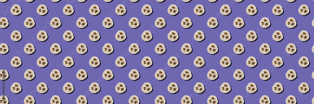 Lifestyle without plastic concept. Seamless pattern of natural loofah sponges on a purple background. Wide banner. Lifestyle without plastic concept. Seamless pattern of natural loofah sponges on a purple background. Wide banner.