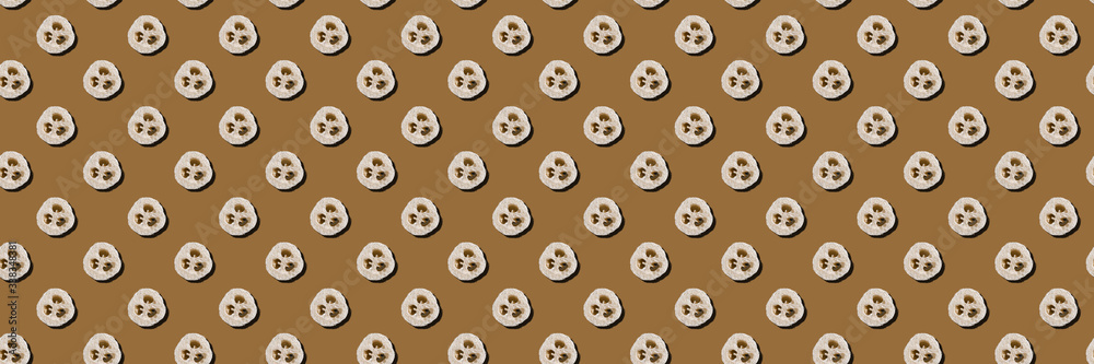 Lifestyle without plastic concept. Seamless pattern of natural loofah sponges on a brown background. Wide banner. Lifestyle without plastic concept. Seamless pattern of natural loofah sponges on a brown background. Wide banner.