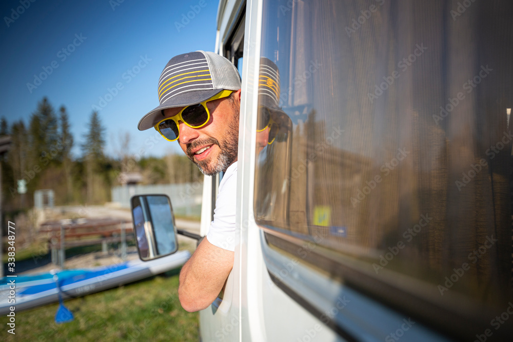 Portrait of careless man during holidays camping in his van
