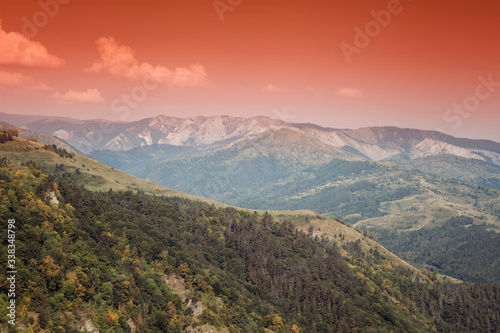 colorful autumn landscape, hills and mountains in evening © andreiuc88