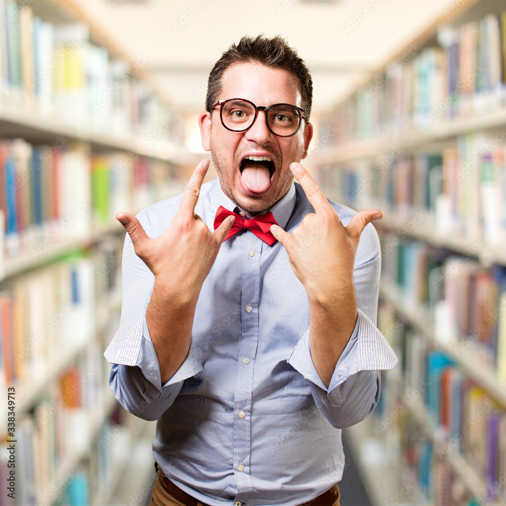 Man wearing a red bow tie. Rocker gesture. Man wearing a red bow tie. Rocker gesture.