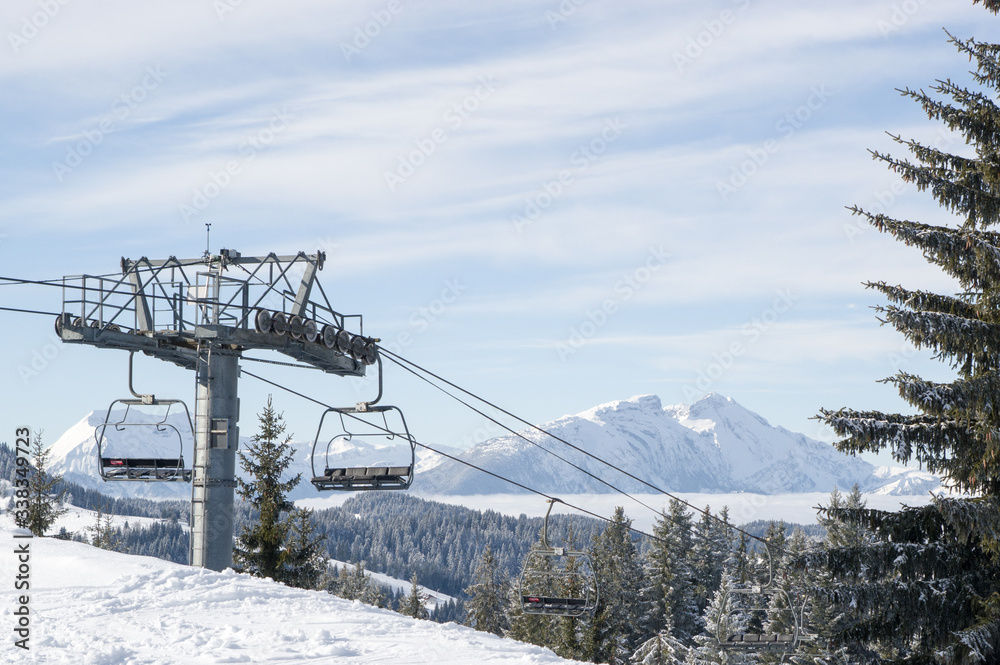 Ski Chairlift going down a mountain in the French Alps