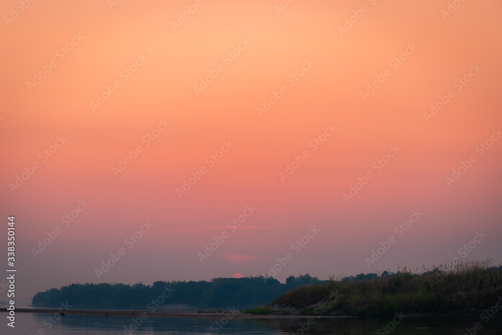Scenic View Of landscape Against Sky During Sunset