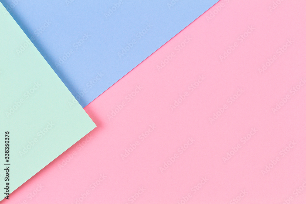 Abstract colored paper texture background. Minimal geometric shapes and lines in pastel pink, light blue and green colours Abstract colored paper texture background. Minimal geometric shapes and lines in pastel pink, light blue and green colours