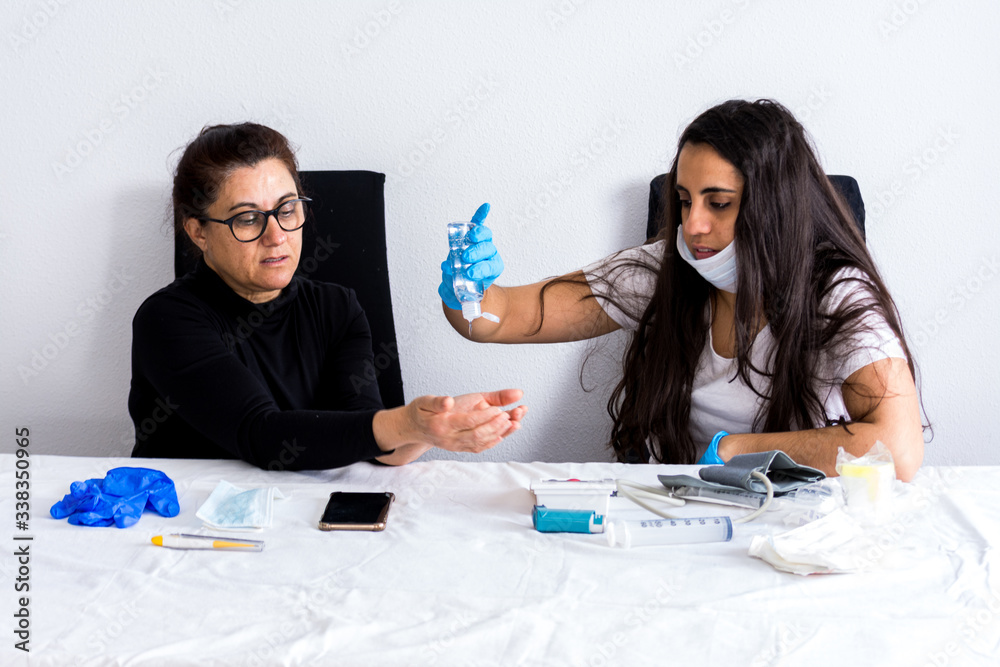 Patient with asthma and respiratory problems being treated by a nurse in the hospital. Coronavirus pandemic. Patient with asthma and respiratory problems being treated by a nurse in the hospital. Coronavirus pandemic.