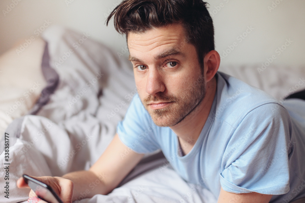 Close up portrait of a handsome man in bed Close up portrait of a handsome man in bed