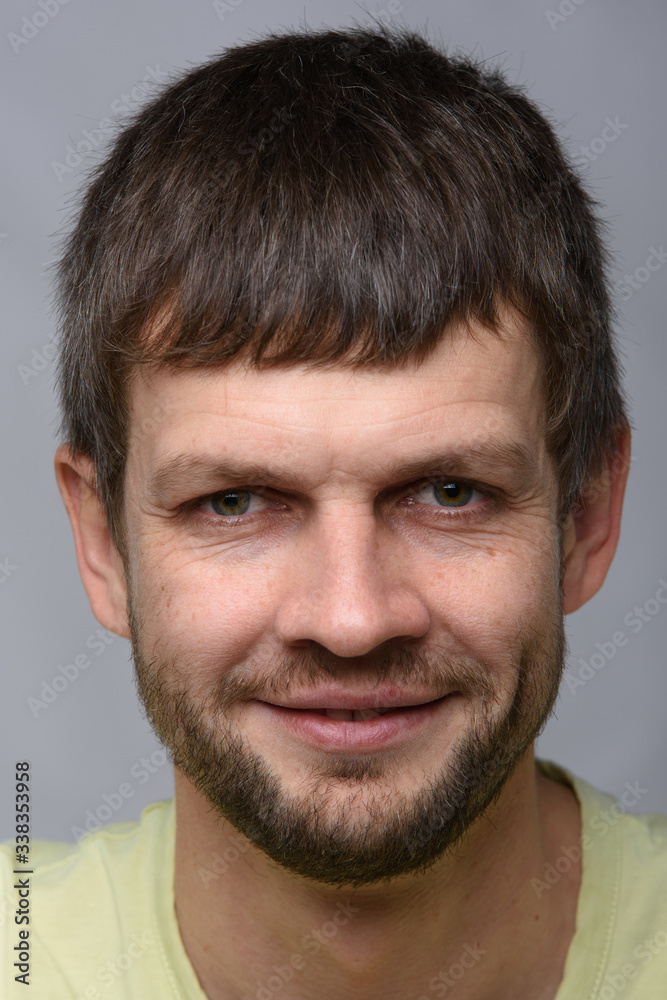Closeup portrait of a successful smiling man of European appearance Closeup portrait of a successful smiling man of European appearance