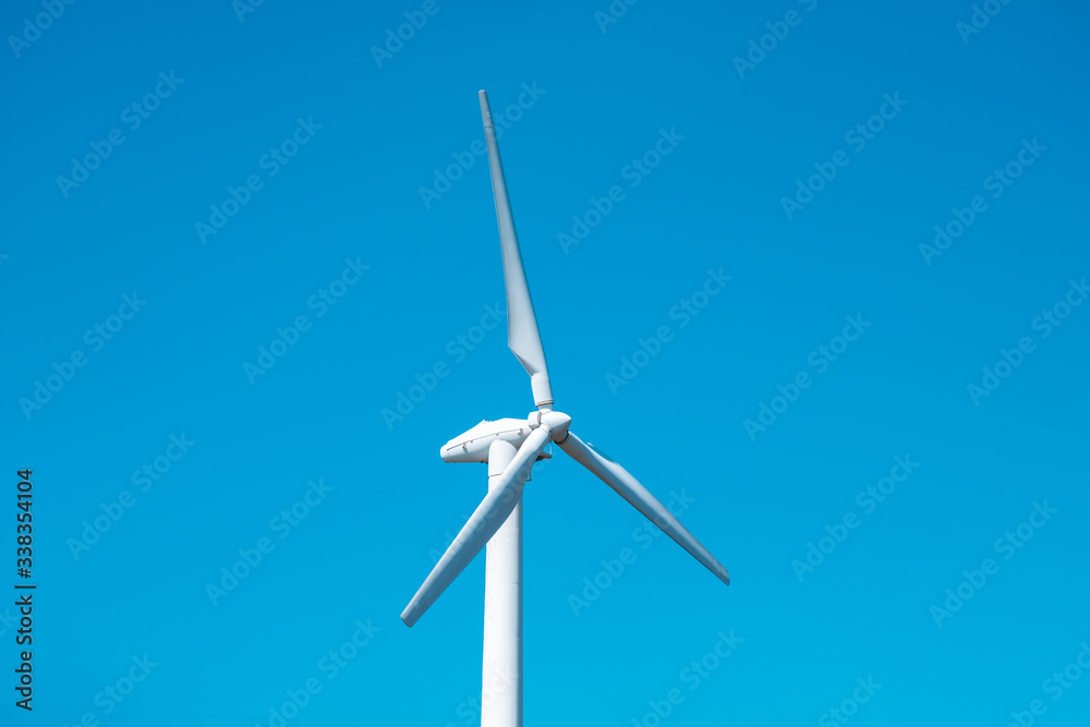 Wind turbine and clean blue sky, windmill electric turbine Wind turbine and clean blue sky, windmill electric turbine