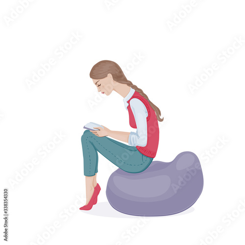 A young woman with a plait in a pink waistcoat and jeans sitting on a beanbag chair and reading a book. A student girl. Vector illustration.