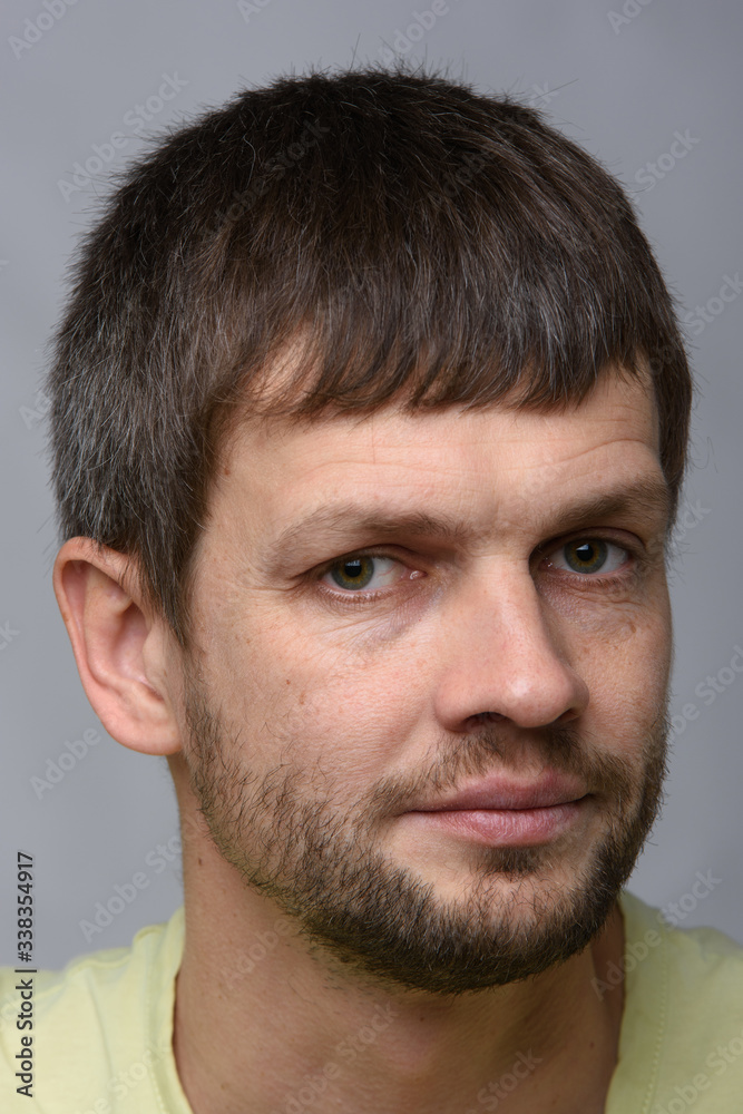 Portrait of a sad man of European appearance, slightly turned his head to the right Portrait of a sad man of European appearance, slightly turned his head to the right