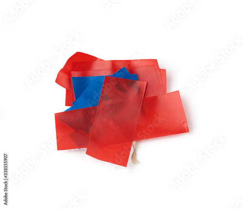 used red pieces of electrical tape isolated on white background