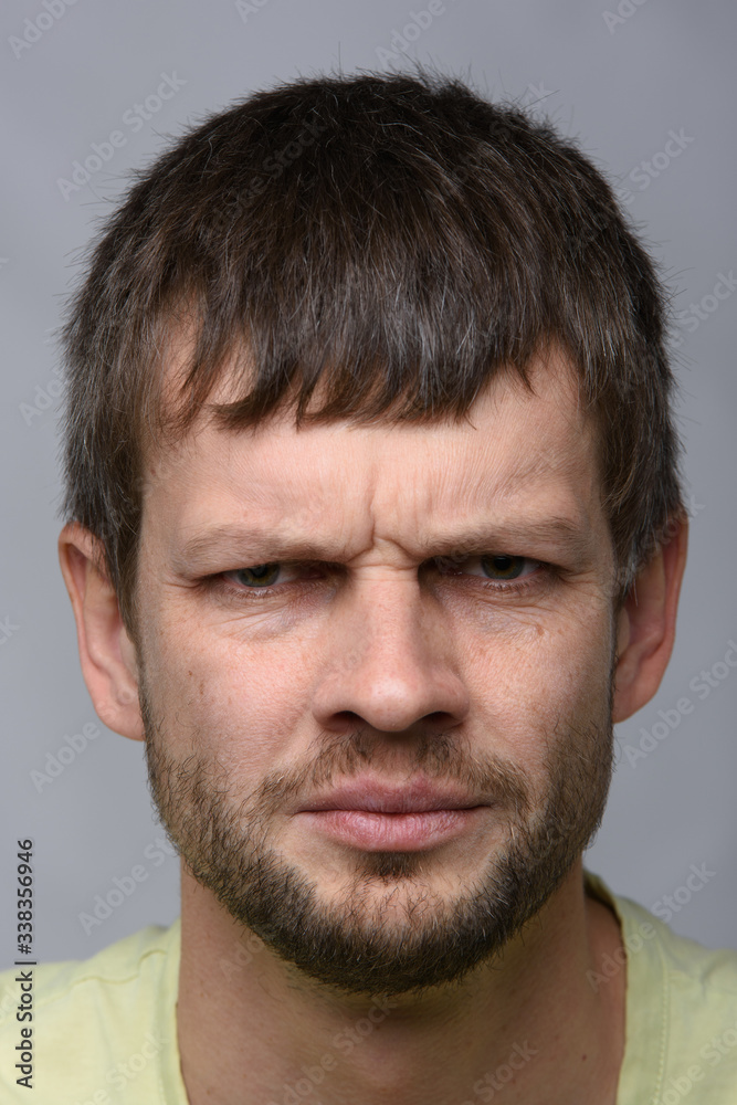 Closeup portrait of an anxious man of European appearance Closeup portrait of an anxious man of European appearance