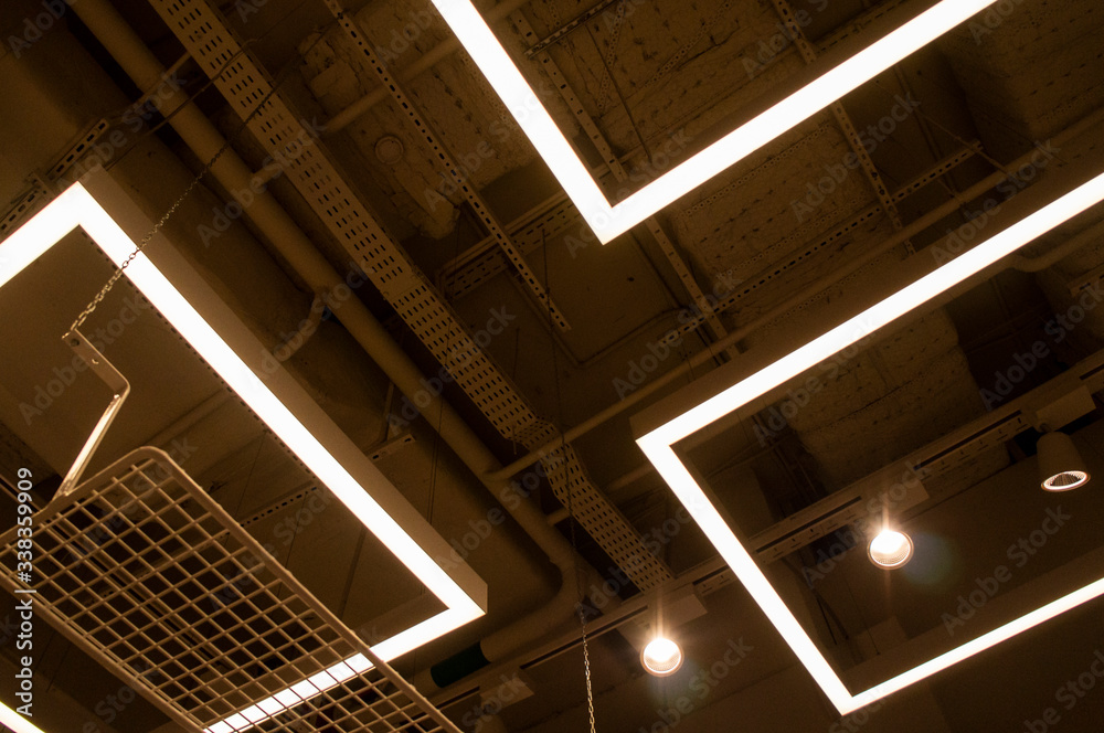 Fototapeta premium LED lamps and ceiling lighting in the mall. Moscow, Russia - April 14 2020