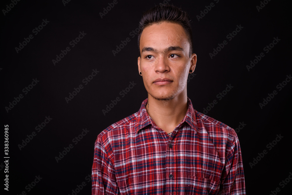 Face of young handsome Indian hipster man Face of young handsome Indian hipster man