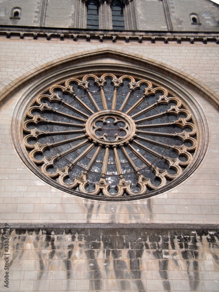 Angers, France - March 15th 2013 : detail of the facade of the cathedral Saint-Maurice. Focus on the rosace. 