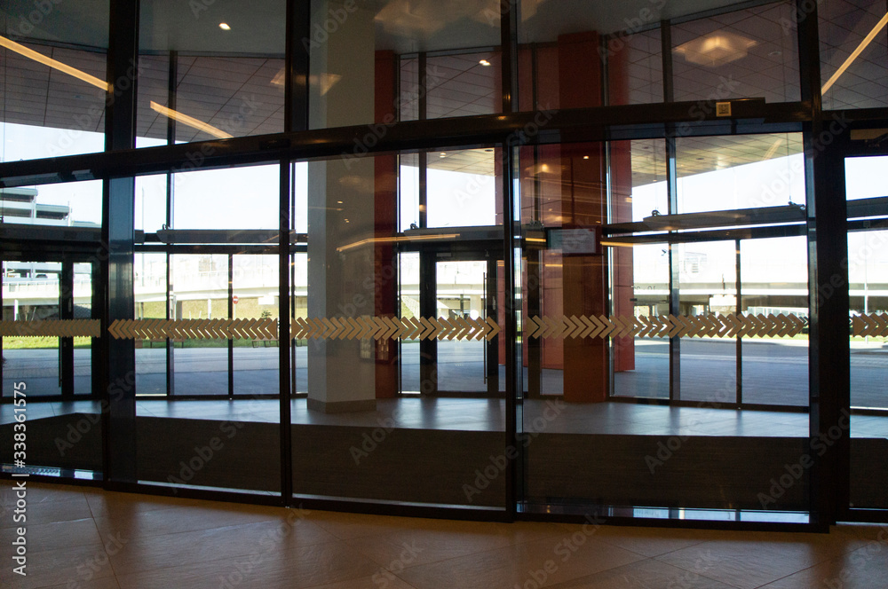 Glass doors in a mall without people. Moscow, Russia - April 14 2020 Glass doors in a mall without people. Moscow, Russia - April 14 2020