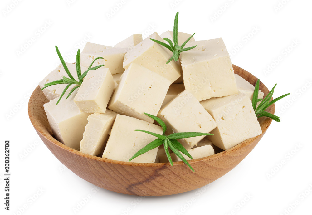 Heap of diced tofu cheese in wooden bowl isolated on white background with clipping path and full depth of field,