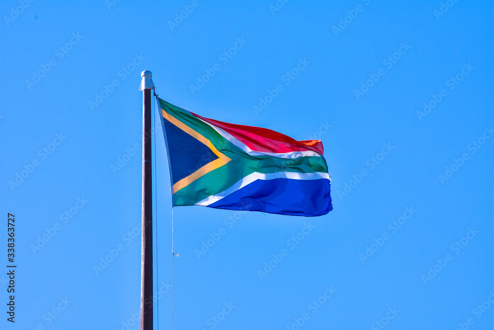 National flag of South Africa with a blue sky