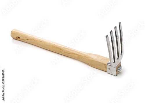 Gardening tools . Gardening rake. Gardening trowel.Metal rake for gardening on white background.