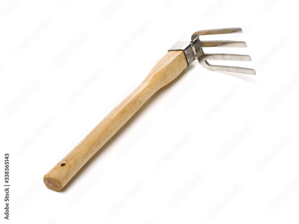 Gardening tools . Gardening rake. Gardening trowel.Metal rake for gardening on white background. Gardening tools . Gardening rake. Gardening trowel.Metal rake for gardening on white background.