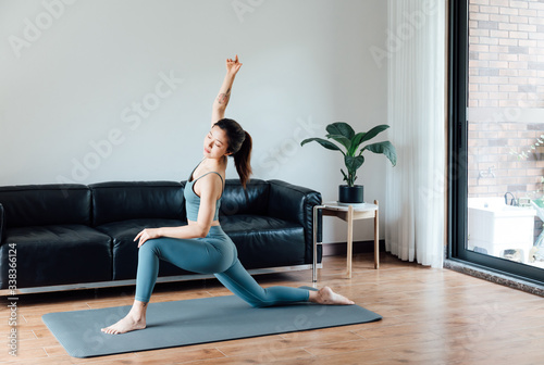 young asian beauty woman doing yoga at home