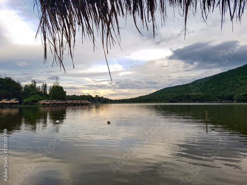 Sunset mirroring lightwater lake huay huai tueng thao reservoir evening summer cloud chiang Mai Thailand mountain hill photo