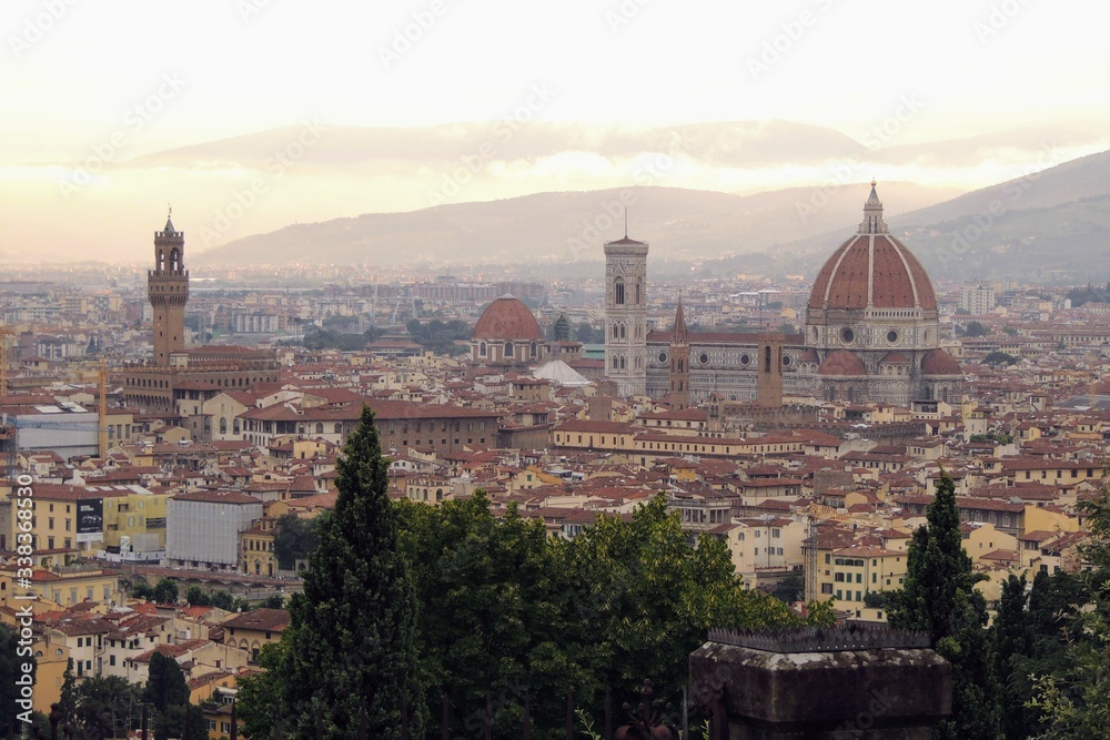 View of the city of Florence Italy at sunset, highlights the Duomo, the Cathedral of Florence Santa Maria del Fiore and the Palazzo Vecchio.