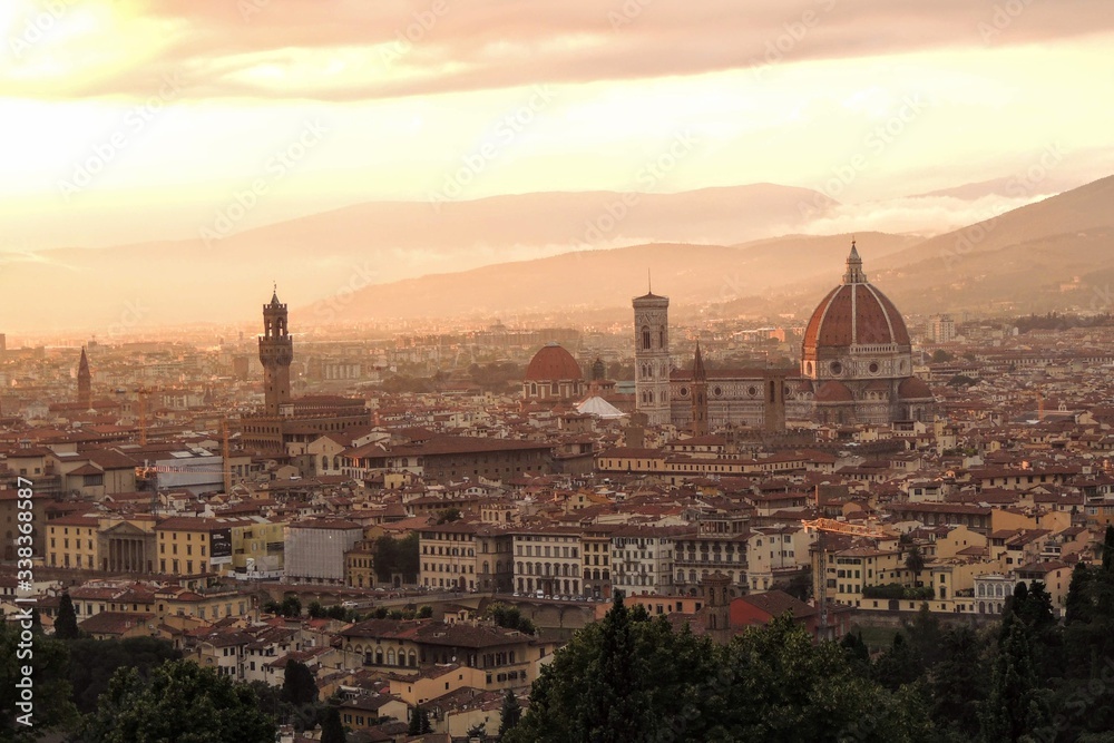 View of the city of Florence Italy at sunset, highlights the Duomo, the Cathedral of Florence Santa Maria del Fiore and the Palazzo Vecchio.