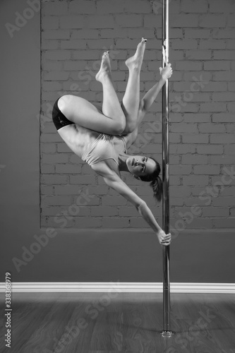 athletic woman making exercises on pilon