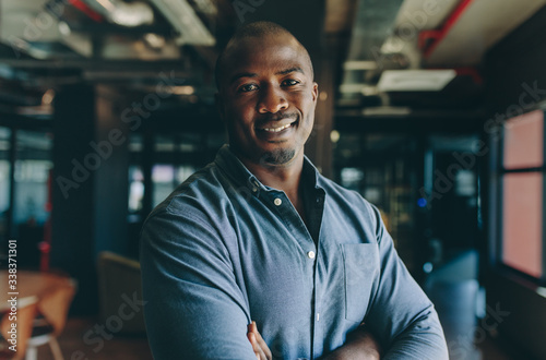 Confident businessman standing in office