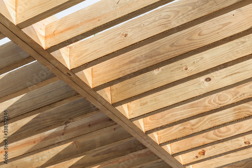 Wooden beams in a row. Sunshade ceiling structure