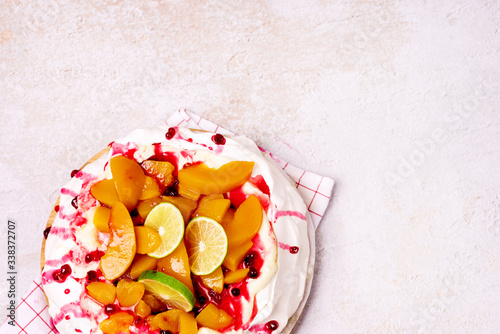 Pavlova Meringue Cake Decorated With Peach Berry Jam and Lime Tasty Homemade Dessert Top View Horizontal